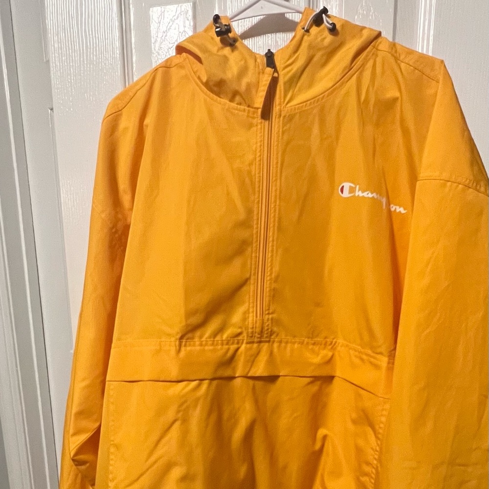 Yellow Champion lightweight XL jacket with front zipper pouch and pockets.